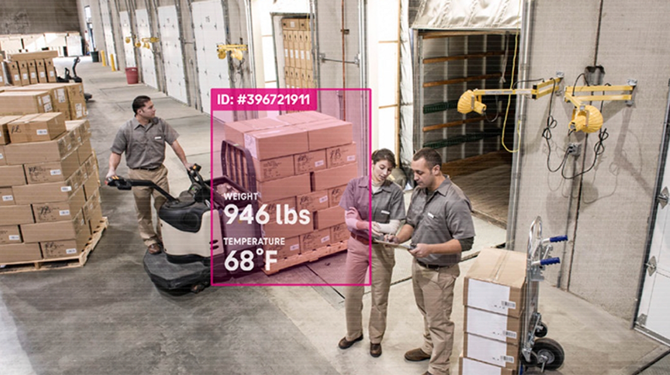 Camera feed of warehouse and workers has data on boxes superimposed over image